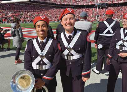 Local band members Dominic Barnes and Hanna Eggenschwiler perform with the OSU marching band.